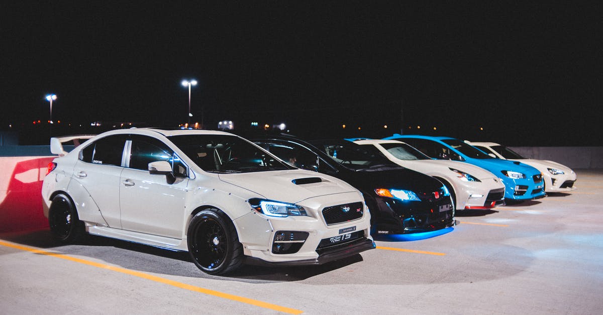 Website to arrange rides with trucks - Colorful cars on parking lot Website to arrange rides with trucks - Colorful cars on parking lot