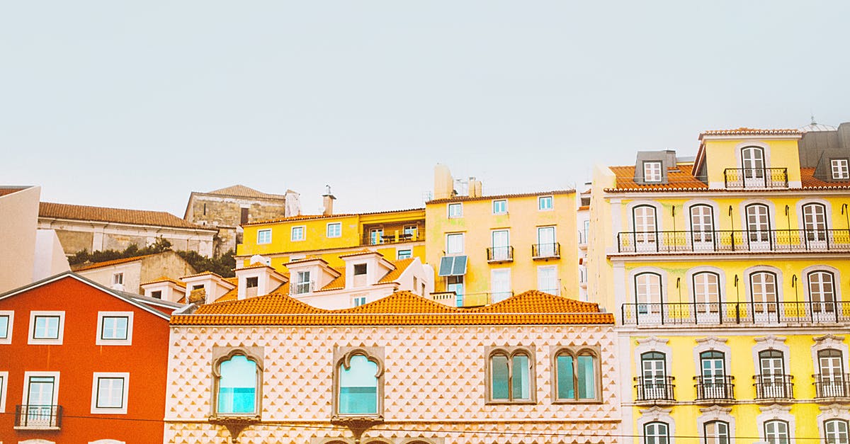 Weed sellers in Lisbon / Portugal - Photograph of Several Assorted-color Concrete Structures Weed sellers in Lisbon / Portugal - Photograph of Several Assorted-color Concrete Structures