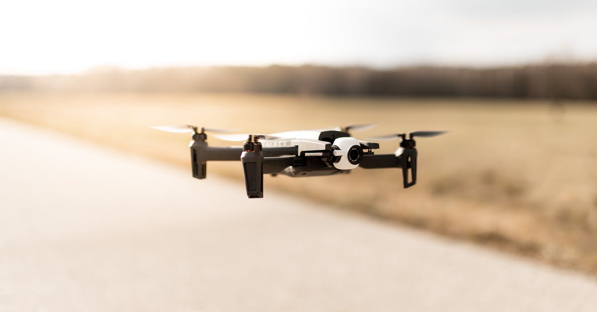 Weird flight path for BA714 - Sep 13, 2018 [closed] - Soft focus of modern quadcopter flying above road out of city near forest