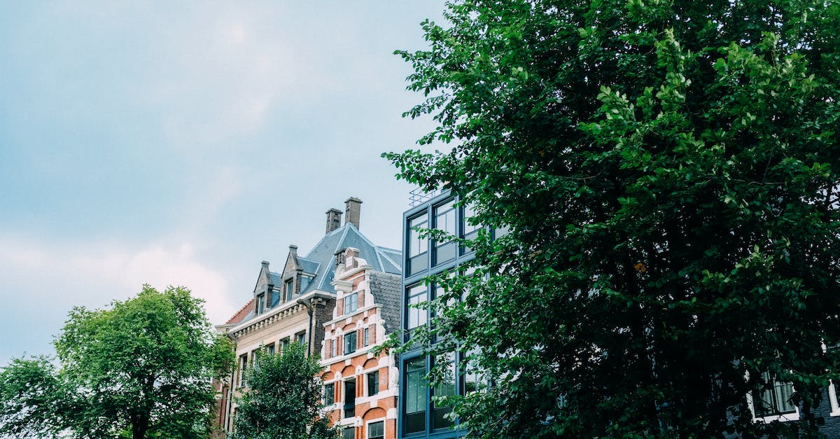 What's a cheap ski location to reach from Amsterdam (Netherlands)? [closed] - Exteriors of various residential buildings against cloudy sky