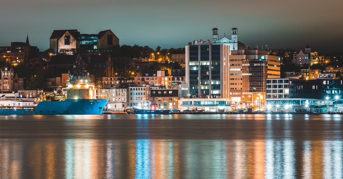 What's a good location to stargaze in Auckland? - Various ships moored in harbor of coastal illuminated city at night What's a good location to stargaze in Auckland? - Various ships moored in harbor of coastal illuminated city at night