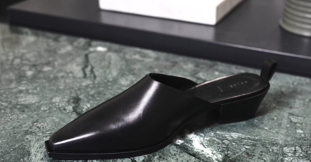 What's the cheapest way to buy British Pounds in New Zealand - Stylish shiny shoe on marble surface What's the cheapest way to buy British Pounds in New Zealand - Stylish shiny shoe on marble surface
