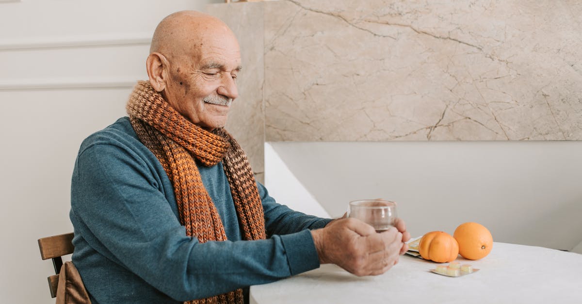 What's the drinking age on Icelandair? - Man in Blue Sweater Holding Clear Glass Mug What's the drinking age on Icelandair? - Man in Blue Sweater Holding Clear Glass Mug