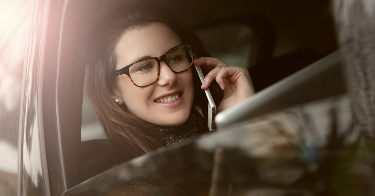 What's the most cost-effective service for calling landlines while travelling? - Sideview Photo of a Woman Using Mobile Phone What's the most cost-effective service for calling landlines while travelling? - Sideview Photo of a Woman Using Mobile Phone
