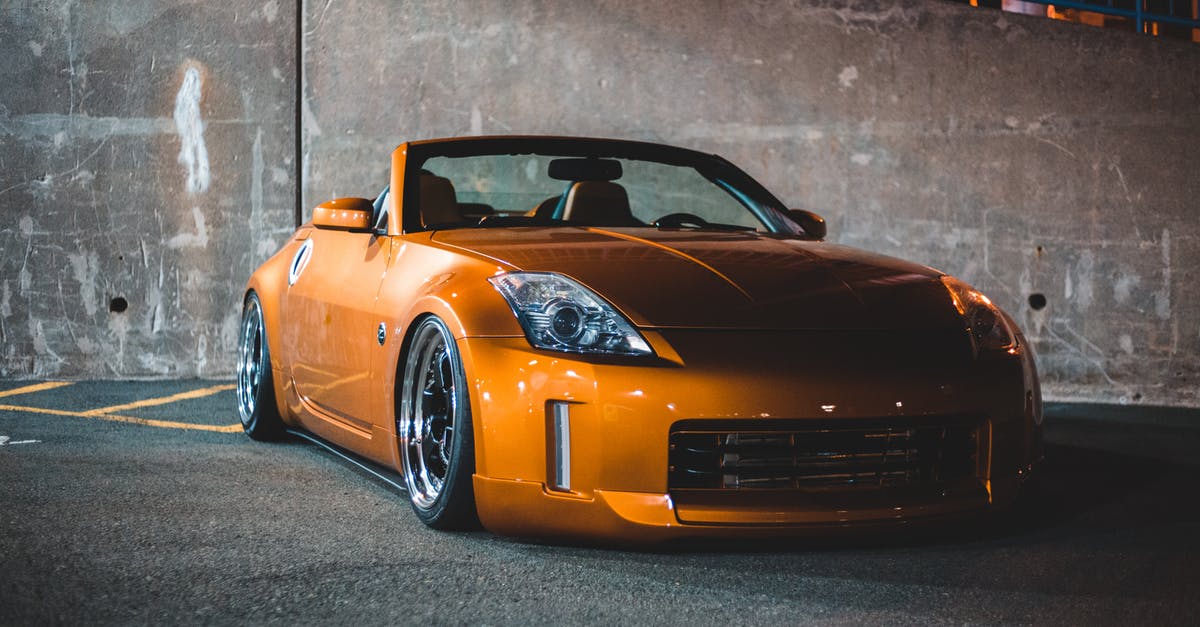 What's the most expensive parking spot in the world? [closed] - Bright contemporary sports auto with creative tuning parked on asphalt pavement in night city