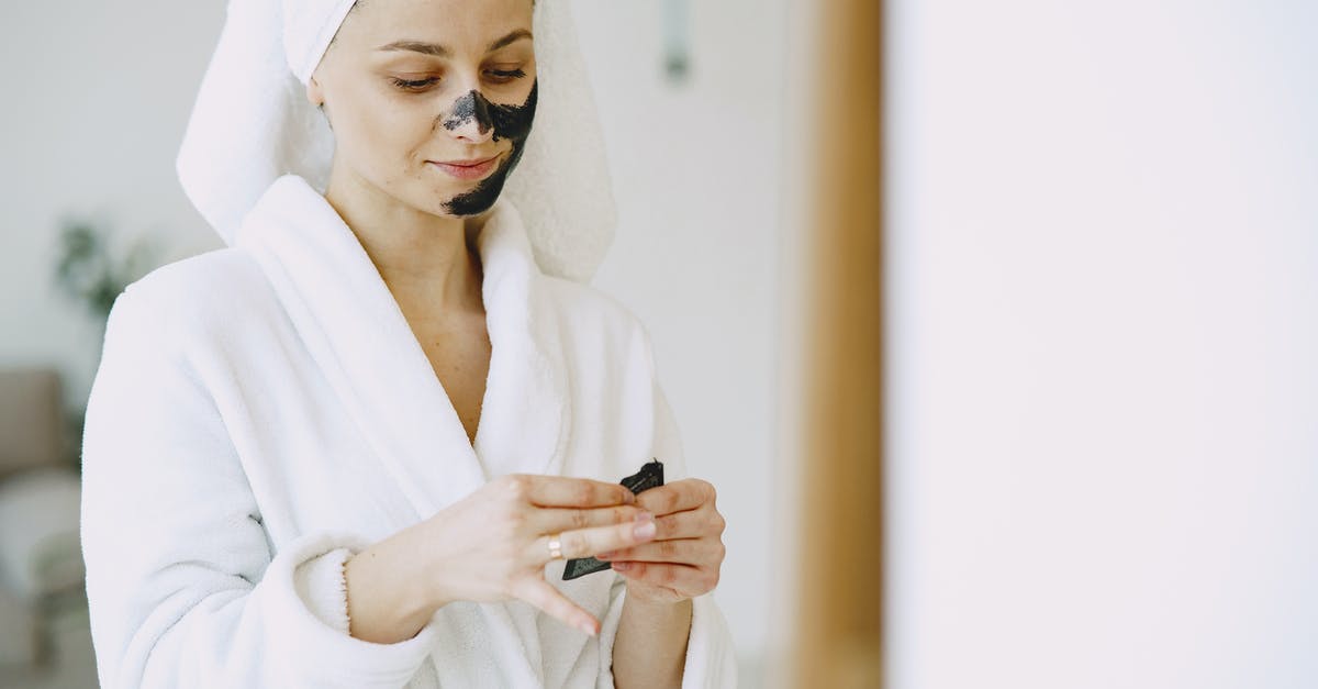 What's the use for this shower drain cover? - Crop satisfied woman applying mask on face at home What's the use for this shower drain cover? - Crop satisfied woman applying mask on face at home