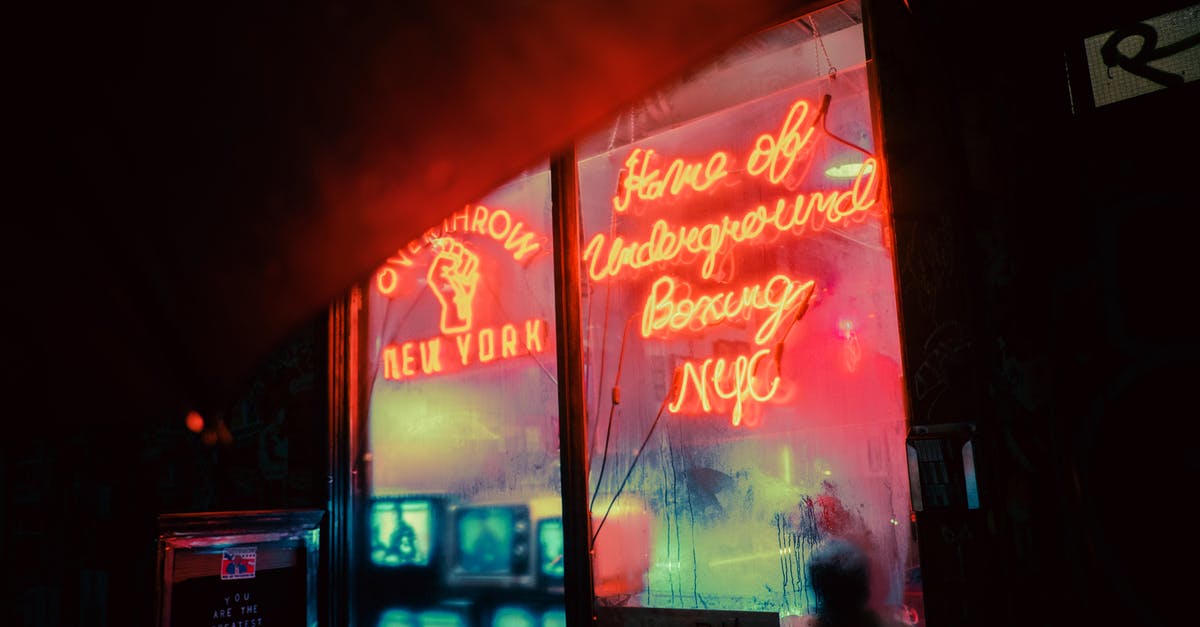 What's with NYC hotel prices in late March? - Exterior of shop with shiny neon inscriptions and vintage TV sets on street in late evening What's with NYC hotel prices in late March? - Exterior of shop with shiny neon inscriptions and vintage TV sets on street in late evening