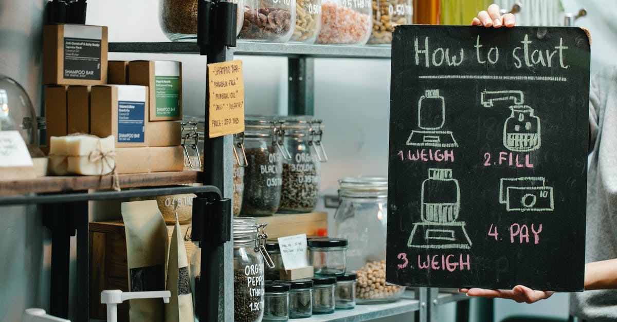 What are fair prices for most common goods in Cambodian markets? [closed] - Assorted natural products and food in glass jars and paper packages on shelves in self service eco shop