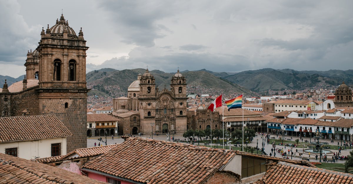 What are good and cheap places in South America to surf? - Cityscape of medieval church and houses with old tile roof in Cusco Peru What are good and cheap places in South America to surf? - Cityscape of medieval church and houses with old tile roof in Cusco Peru