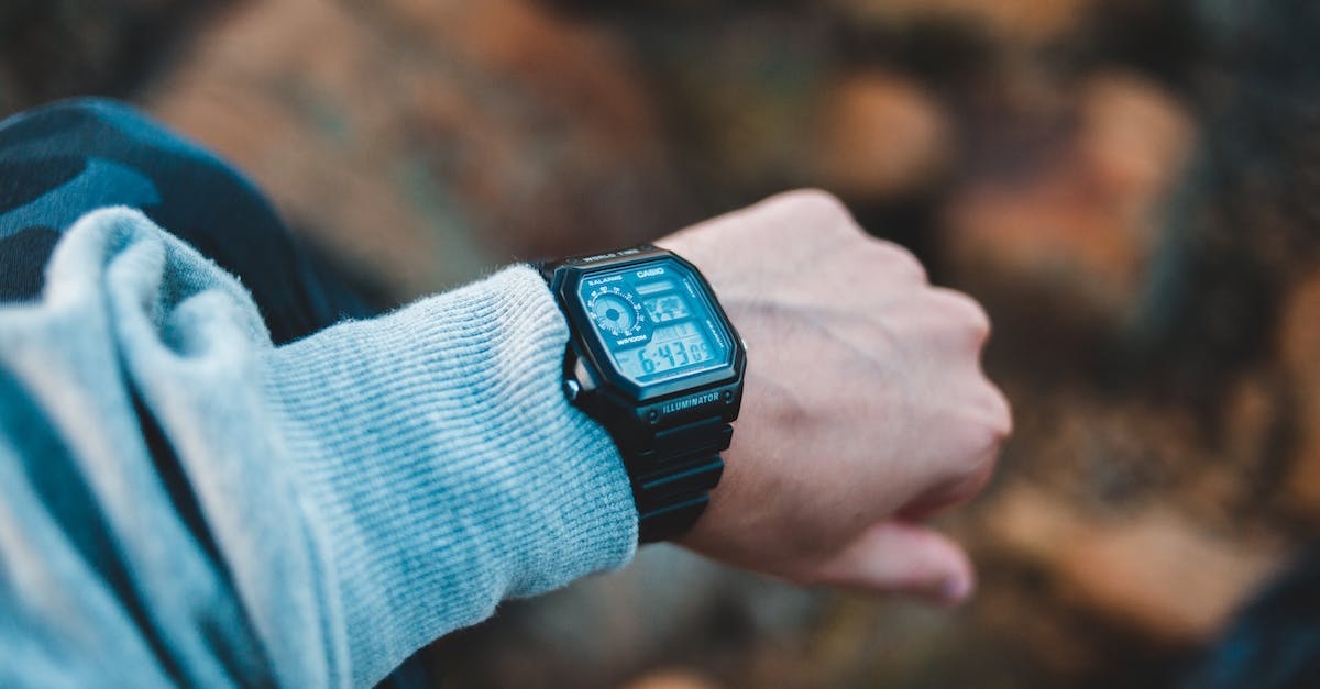 What are must-visit destinations for the first time trip to Argentina? [closed] - Crop man with wristwatch on hand