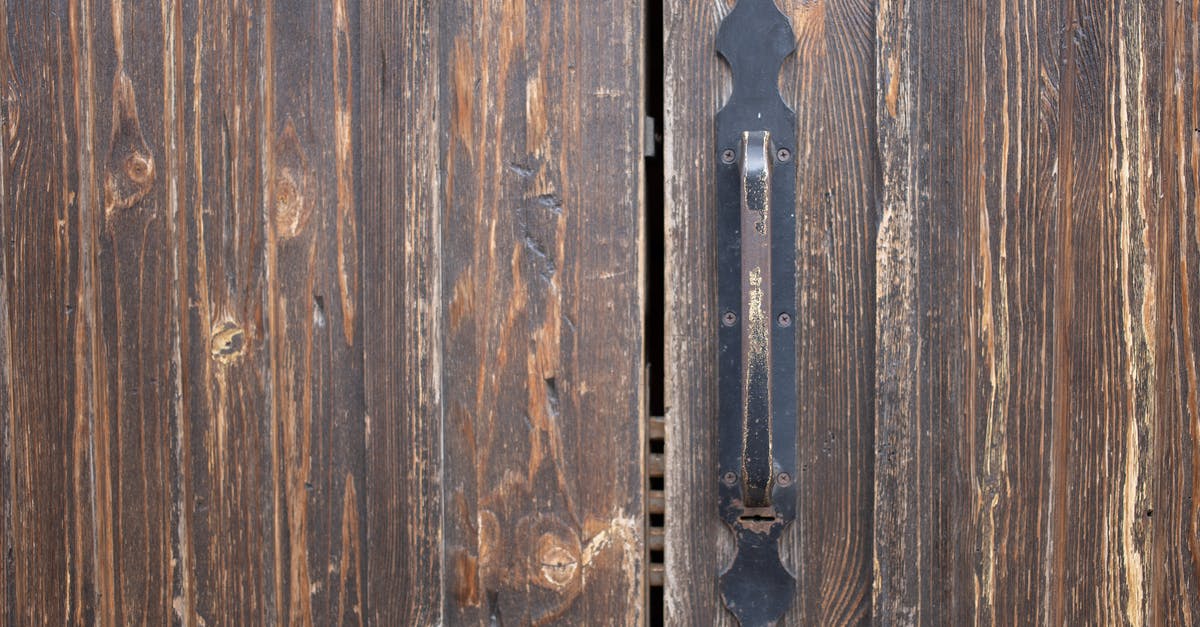 What are safe uses of non-potable water? - Closeup of weathered old rusty brown locked wooden door with cracks on surface with aged metal handle What are safe uses of non-potable water? - Closeup of weathered old rusty brown locked wooden door with cracks on surface with aged metal handle
