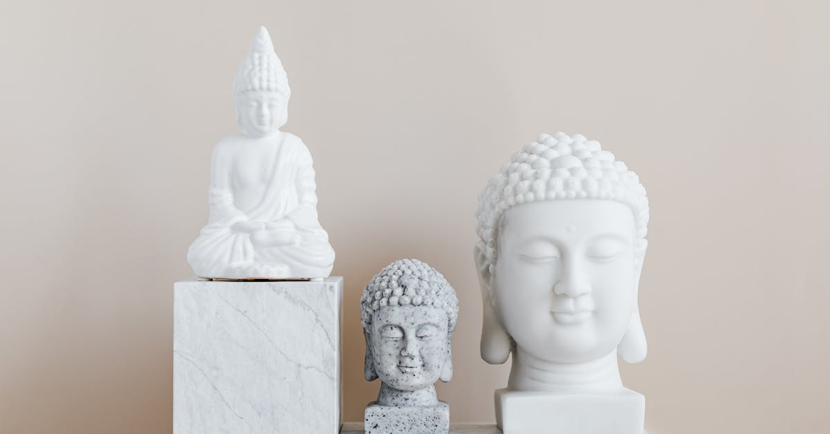 What are some significant places of un-touched natural beauty, traditional culture and history in Thailand? [closed] - Collection of Asian busts and statue of Buddha made of white and gray stone with smooth surface on marble pedestal