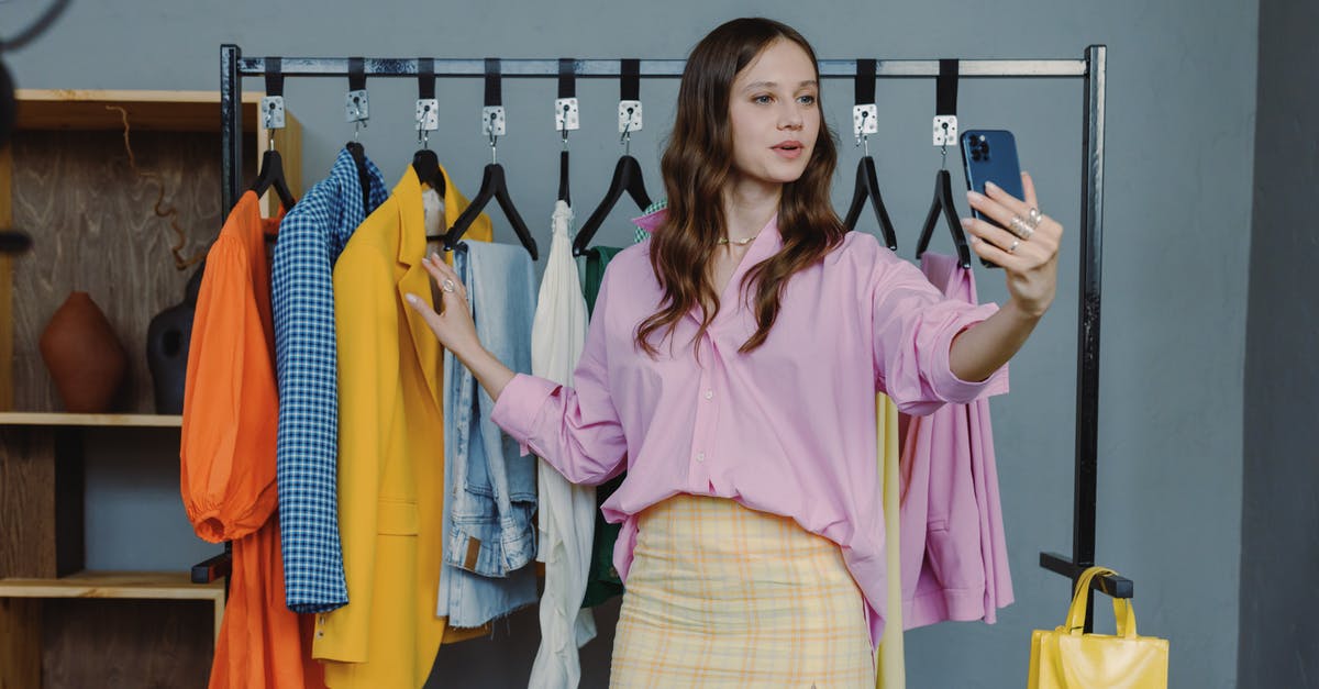 What are some technical words that I should avoid using while giving F1 visa interview? [closed] - Woman in Pink Dress Shirt Standing Near Clothes Rack