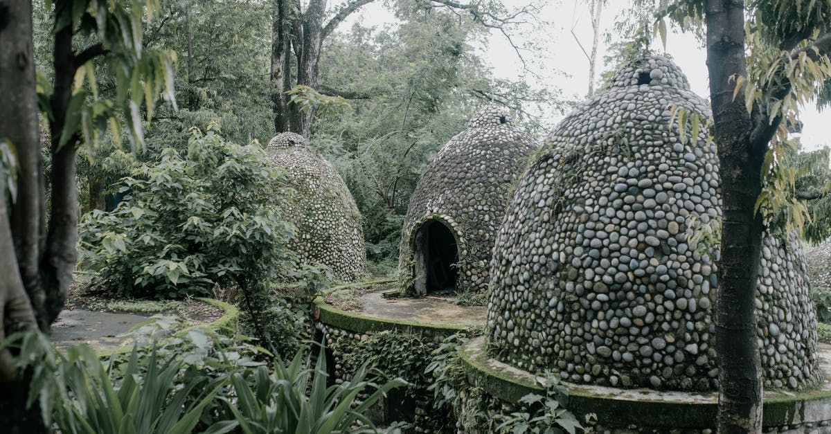 What are the documents necessary for a 15 year-old Nepalese to travel to India? [duplicate] - Exterior of aged stone meditation caves located on territory of Beatles Ashram in lush green tropical garden in India