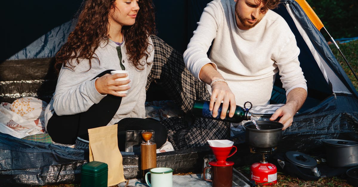 What are the legal consequences for a tourist who runs out of gas on the Autobahn? - Crop hikers preparing hot drink in campsite What are the legal consequences for a tourist who runs out of gas on the Autobahn? - Crop hikers preparing hot drink in campsite