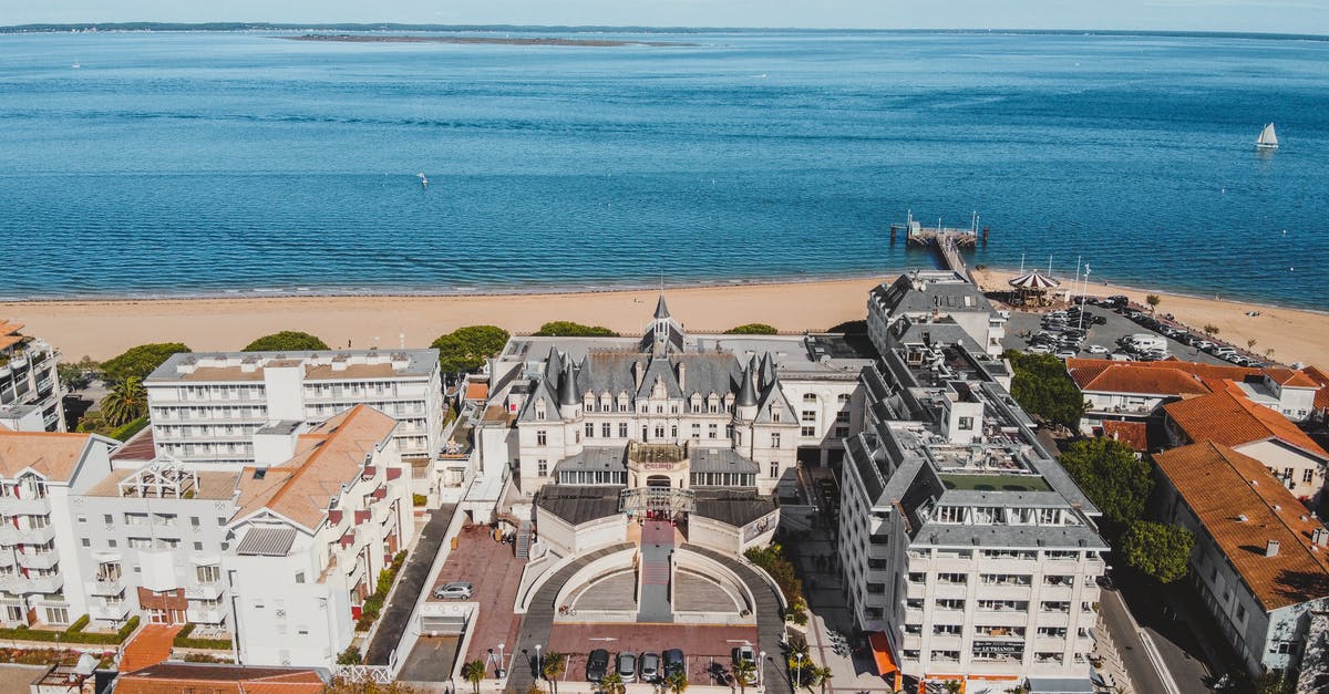 What are the lightest travel adapters/converters available for France? - Aerial View of City Buildings Near Sea What are the lightest travel adapters/converters available for France? - Aerial View of City Buildings Near Sea