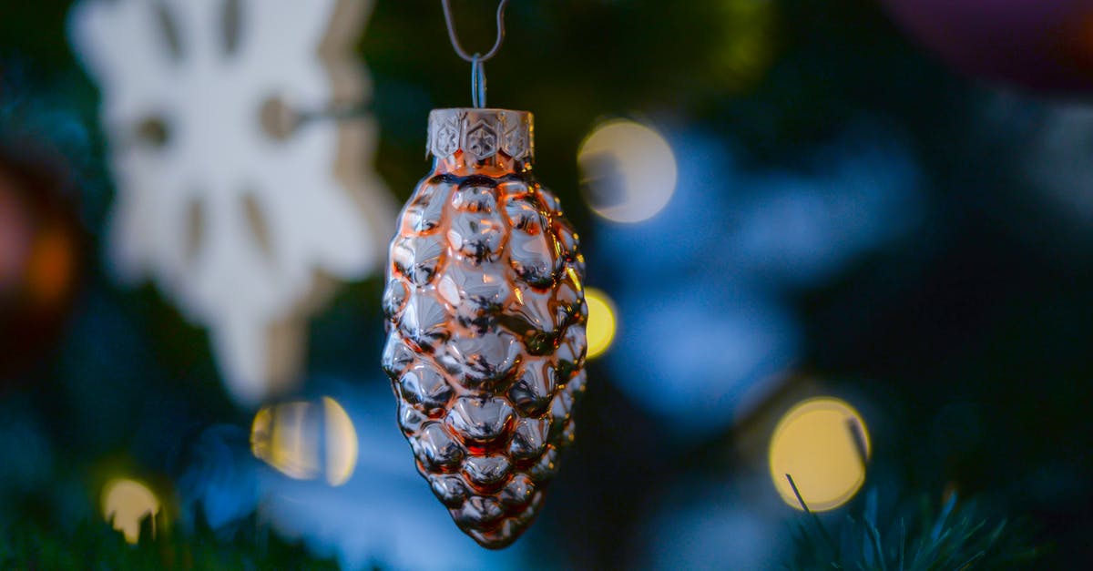 What are the main obstacles to seeing the Northern Lights in Reykjavik in December? [closed] - Amber Glass Pine Cone Ornament