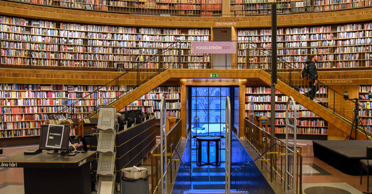 What are the material differences, UK visitor visa vs USA visitor visa - Contemporary library interior with entrance under stairs What are the material differences, UK visitor visa vs USA visitor visa - Contemporary library interior with entrance under stairs