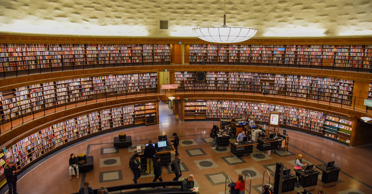 What are the material differences, UK visitor visa vs USA visitor visa - Modern public library with anonymous employees and visitors in hall What are the material differences, UK visitor visa vs USA visitor visa - Modern public library with anonymous employees and visitors in hall