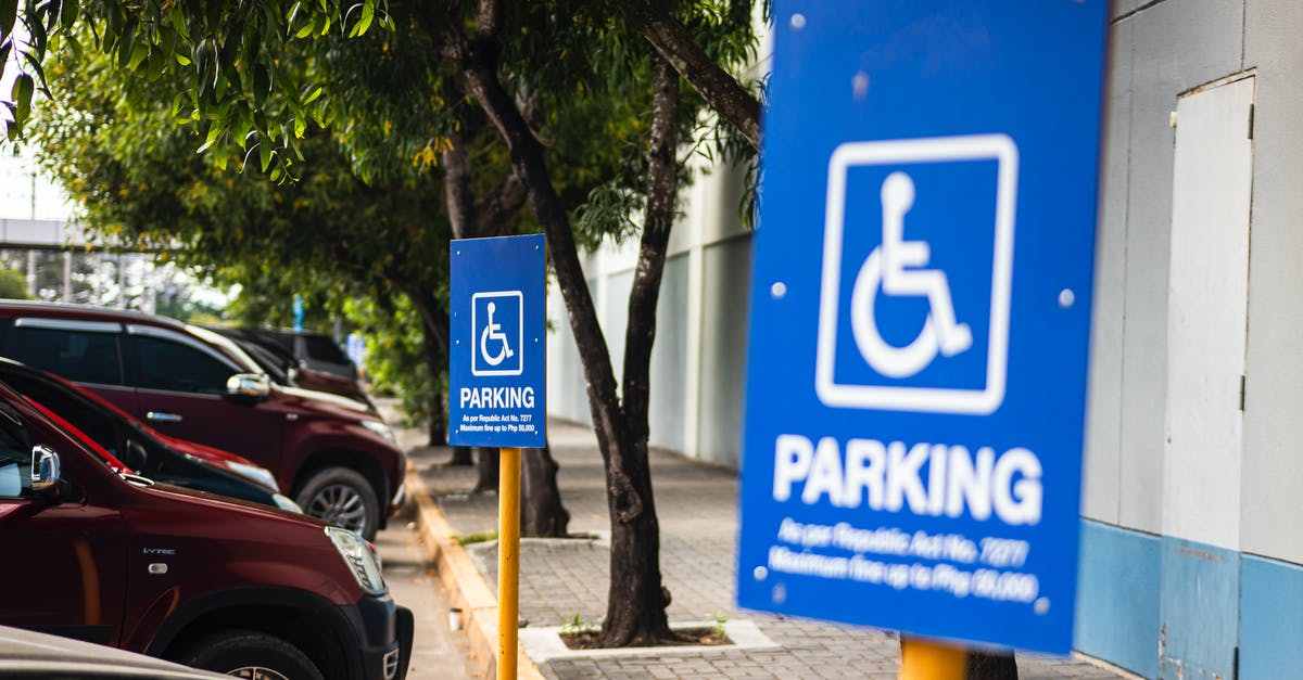 What are the parking regulations in Brooklyn? - Disabled parking sign on street with transport What are the parking regulations in Brooklyn? - Disabled parking sign on street with transport