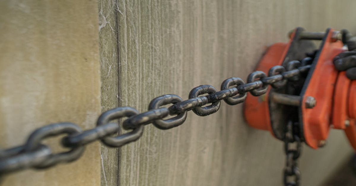 What are the pros & cons of locking zipper pulls to a lock embedded in the suitcase? - Stretched Metal Chain from a Pulley