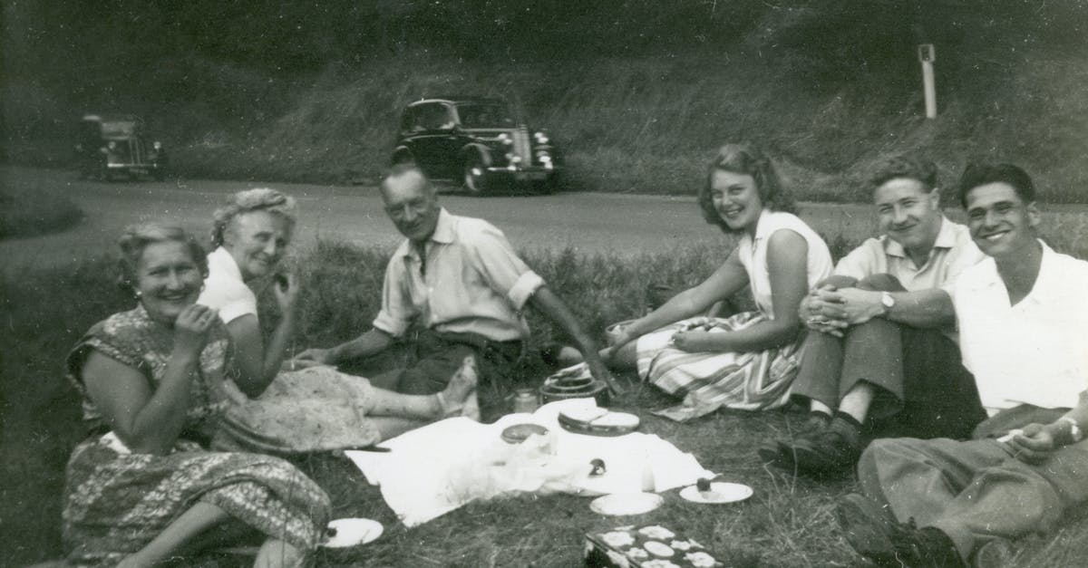 What are the requirements for a UK family visa for a five year old child - Grayscale Photo of 4 Men Sitting on Grass What are the requirements for a UK family visa for a five year old child - Grayscale Photo of 4 Men Sitting on Grass