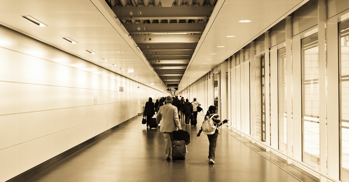 What are the rules for a non-EU family member travelling with an EU national? - People Walking in the Hallway Inside the Building What are the rules for a non-EU family member travelling with an EU national? - People Walking in the Hallway Inside the Building