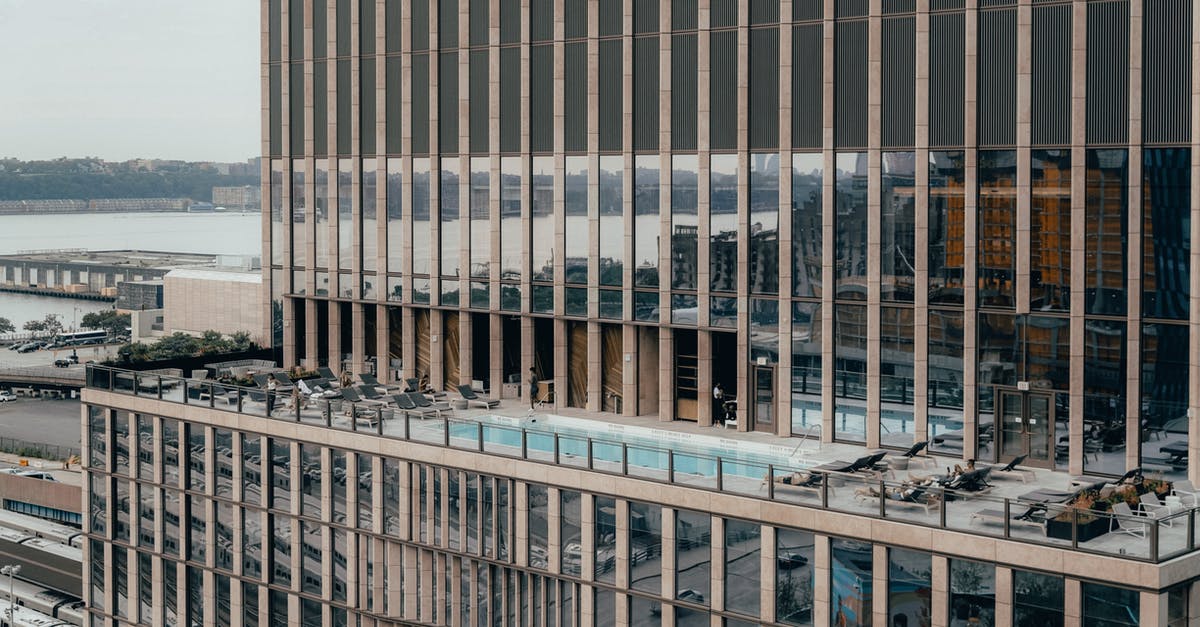 What are the rules for changing after swimming in appartment complex pool in US [closed] - Modern building with swimming pool