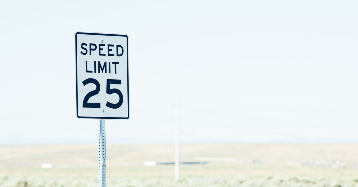 What are the rules on driving with a tow hook in the EU? - White sign on roadside with speed limit against empty green field at daytime What are the rules on driving with a tow hook in the EU? - White sign on roadside with speed limit against empty green field at daytime