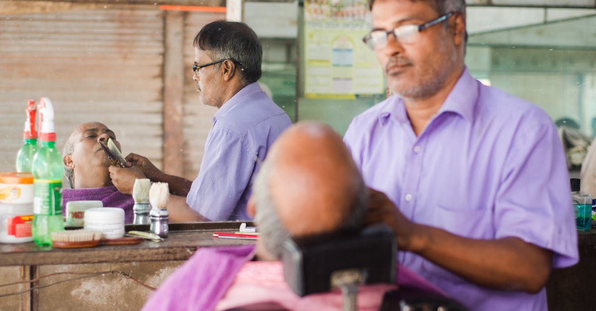 What are the shaving options for the carry-on traveler? - Man in Pink Scrub Suit Sitting on Barber Chair What are the shaving options for the carry-on traveler? - Man in Pink Scrub Suit Sitting on Barber Chair