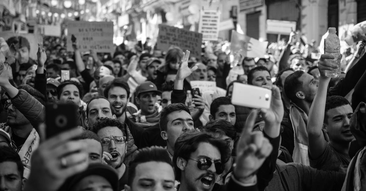What are the Signs that I might get my Italian visa? [closed] - Crowd of People Black and White Photo