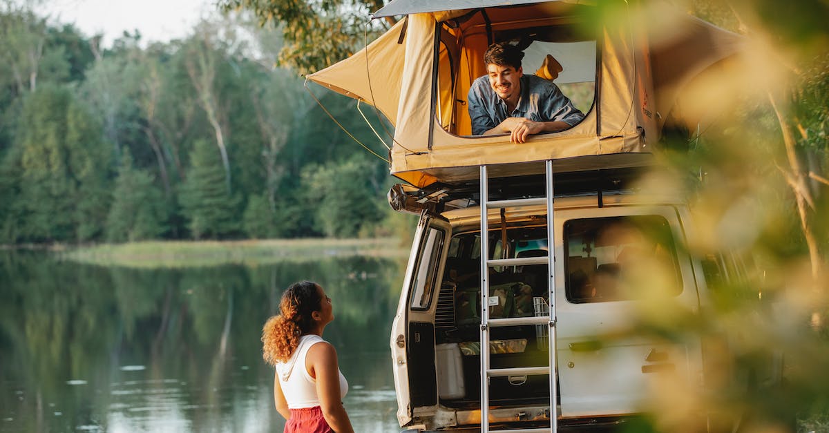 What are the visa (or any other crucial) requirements of Bhutan for tourists? - Couple enjoying camping together on lakeside