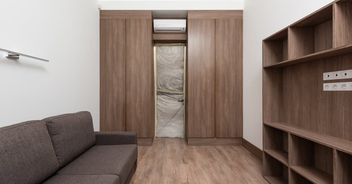 What are these white things in Stuttgart - Brown Wooden Cabinet Near Gray Couch What are these white things in Stuttgart - Brown Wooden Cabinet Near Gray Couch