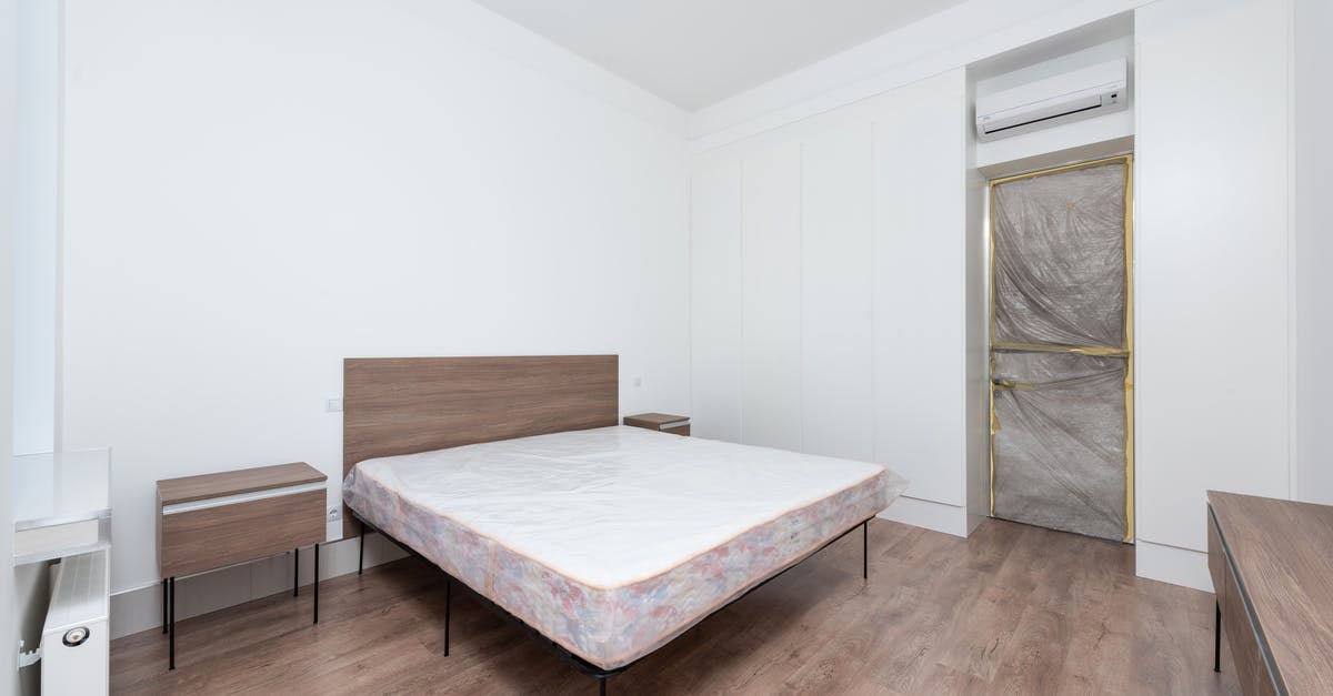 What are these white things in Stuttgart - White Bed Linen on Brown Wooden Bed Frame What are these white things in Stuttgart - White Bed Linen on Brown Wooden Bed Frame