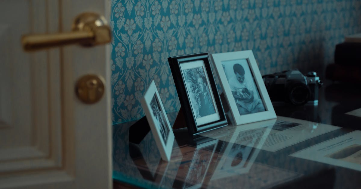 What are this "equations" on door's frames in Germany? [duplicate] - White Wooden Picture Frame on Glass Table