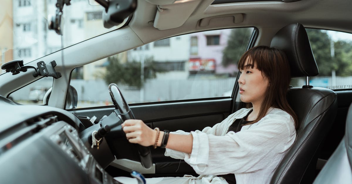 What bypass routes are available for I-70 in Colorado? - Serious Asian woman driving right hand car What bypass routes are available for I-70 in Colorado? - Serious Asian woman driving right hand car