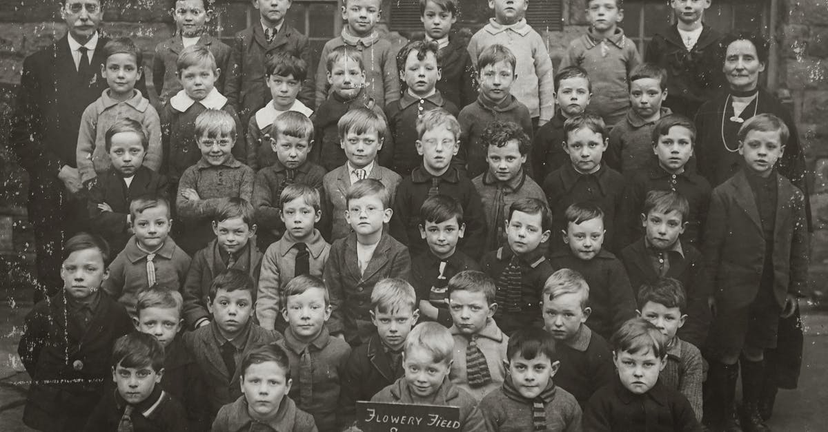 What can be done if there is no one that could countersign kids picture for a British passport? - Old Class Picture Of Boys In Grayscale