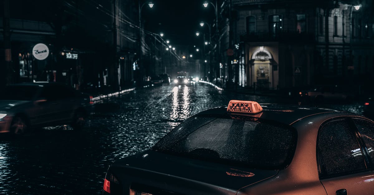 What can I do to make driving in the rain at night easier? [closed] - Taxi placed on street in rainy evening