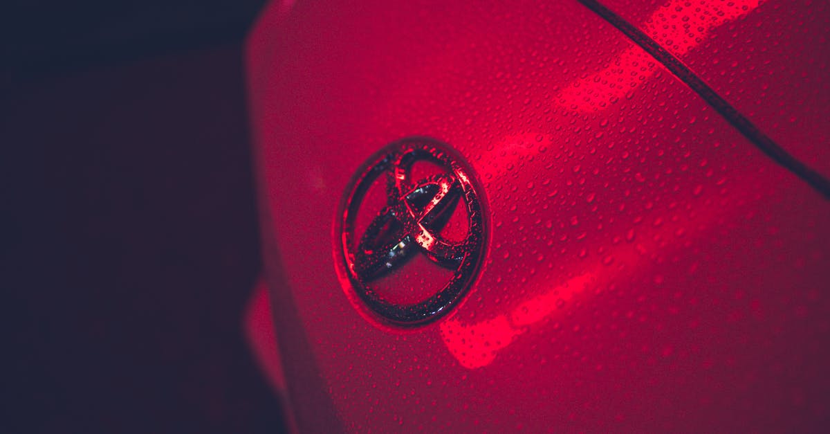 What can I do to make driving in the rain at night easier? [closed] - Hood of automobile with logo