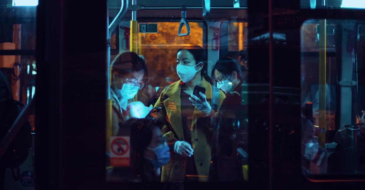 What can I do when I see passengers without masks on my flight? [closed] - People Inside A Bus Wearing Masks