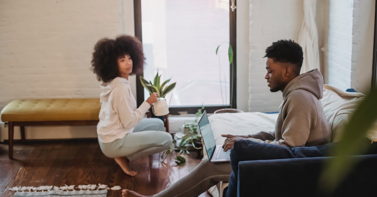 What can I expect when bringing in my netbook to China? - Black couple spending time in light apartment in daytime What can I expect when bringing in my netbook to China? - Black couple spending time in light apartment in daytime