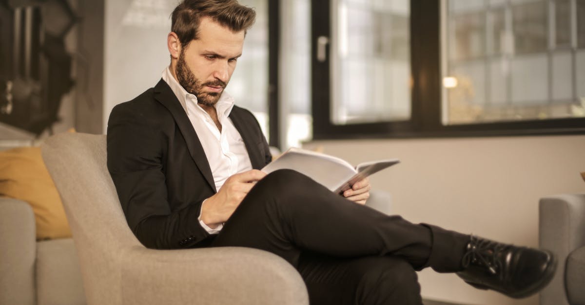 What caveats and hitches about airline seats should a flyer beware of? [closed] - Man in Black Suit Sitting on Brown Couch
