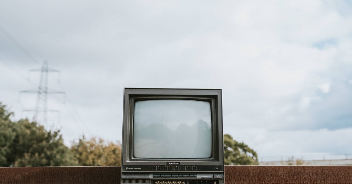 What city is this on the Apple TV screensaver? - Retro TV set placed on stone surface