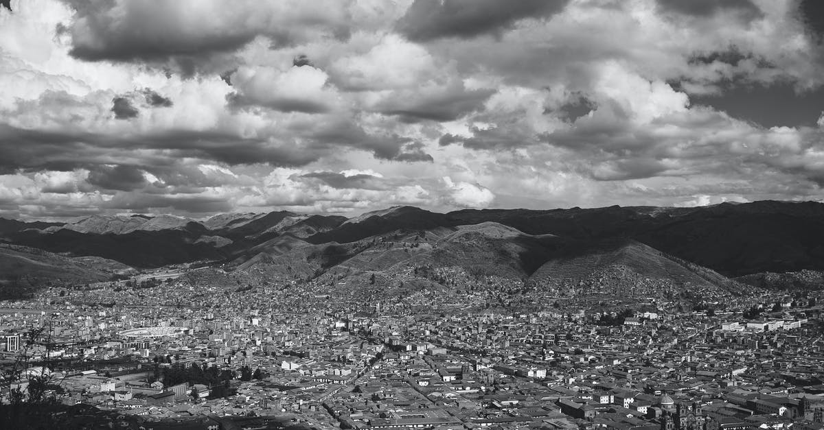 What city skyline is this picture of? - Mountain Ranges near a City What city skyline is this picture of? - Mountain Ranges near a City