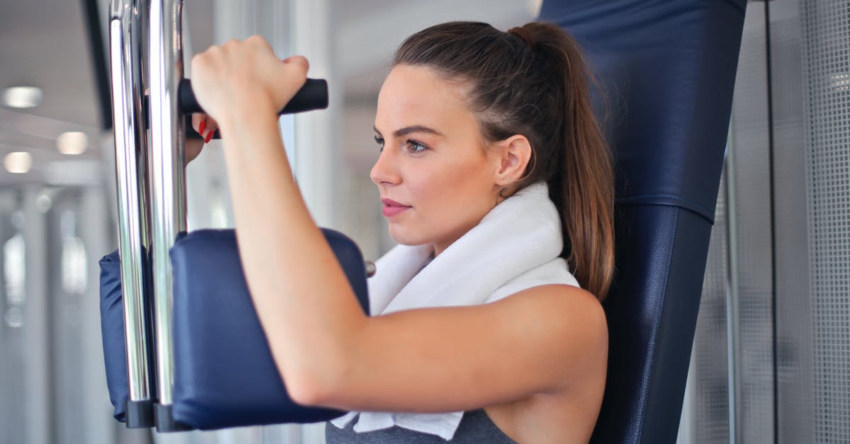 What do Cuban power plugs look like? - Young determined sportswoman doing exercise on weight machine in modern sports club What do Cuban power plugs look like? - Young determined sportswoman doing exercise on weight machine in modern sports club