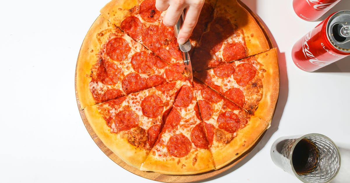 What do they drink in Japan for breakfast, lunch and dinner? [closed] - Person Slicing A Pizza With A Pizza Cutter