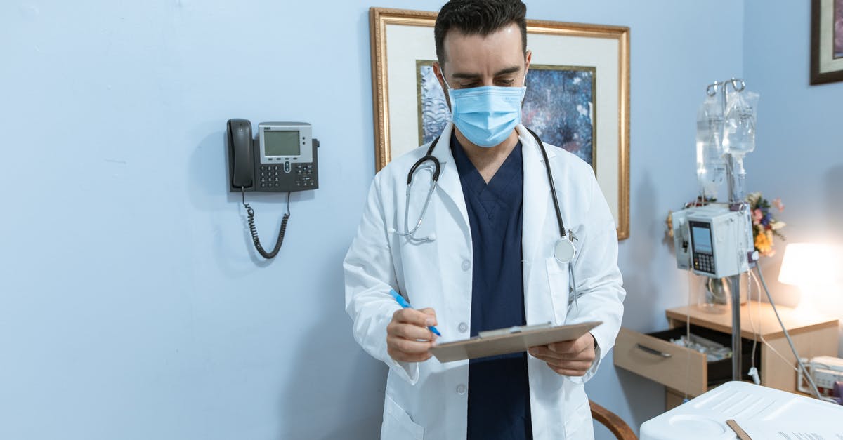 What documents are required to enter the Czech Republic for medical treatment? - A Doctor Reading a Medical Chart What documents are required to enter the Czech Republic for medical treatment? - A Doctor Reading a Medical Chart