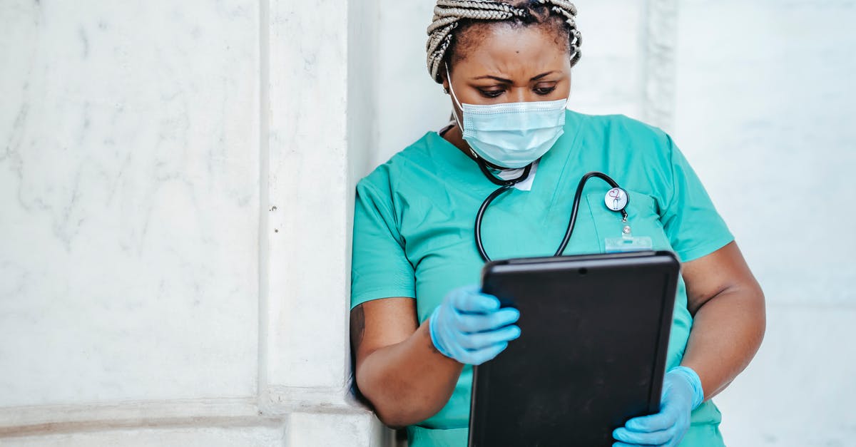 What documents do Irish border control require? - Focused woman with documents in hospital What documents do Irish border control require? - Focused woman with documents in hospital