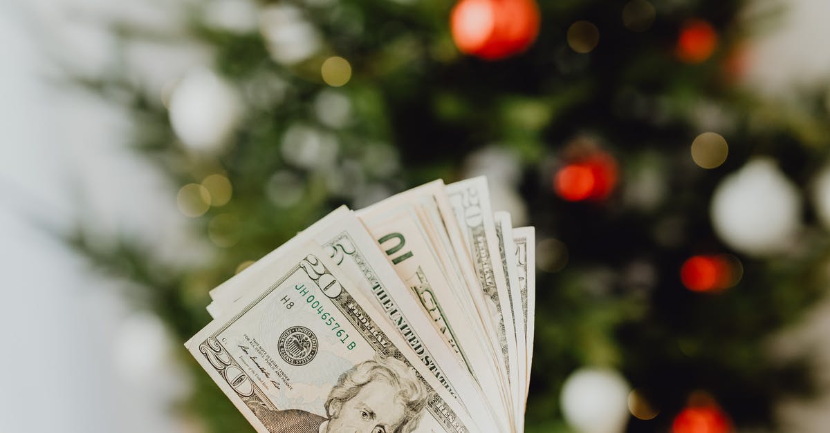 What does a CharlieCard cost? - Person Holding 20 Us Dollar Bill What does a CharlieCard cost? - Person Holding 20 Us Dollar Bill