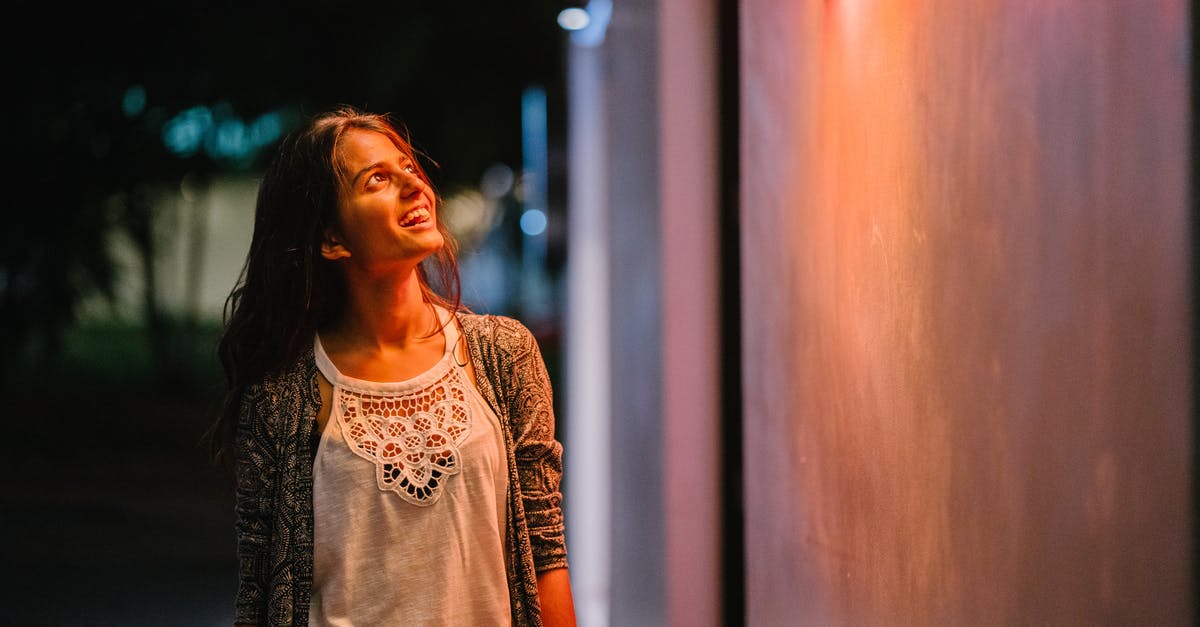 What does a Sri Lankan visa for Indians look like? - Woman in Gray Cardigan Standing Near Wall during Nighttime What does a Sri Lankan visa for Indians look like? - Woman in Gray Cardigan Standing Near Wall during Nighttime